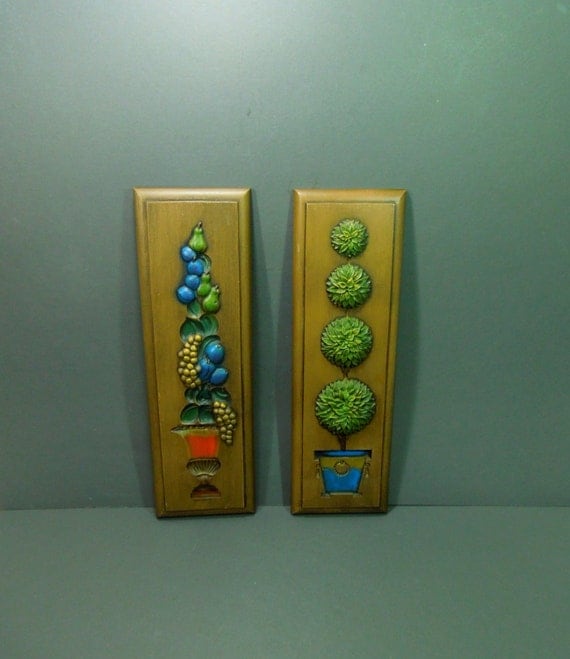 Pair of molded plastic wall plaques with designs by GUTTERSNIPES
