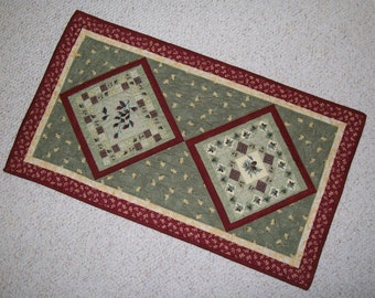Fall table runner - autumn pine cone leaf topper - small rustic quilted runner - moss green, burgundy red, cream, brown - earth tone colors
