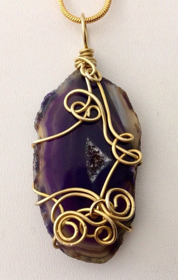 Wire wrapped agate stone pendant necklace on a 22 inch gold