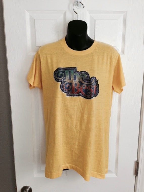 Vintage 1970s The Best yellow t-shirt glitter by thriftyoutfitters