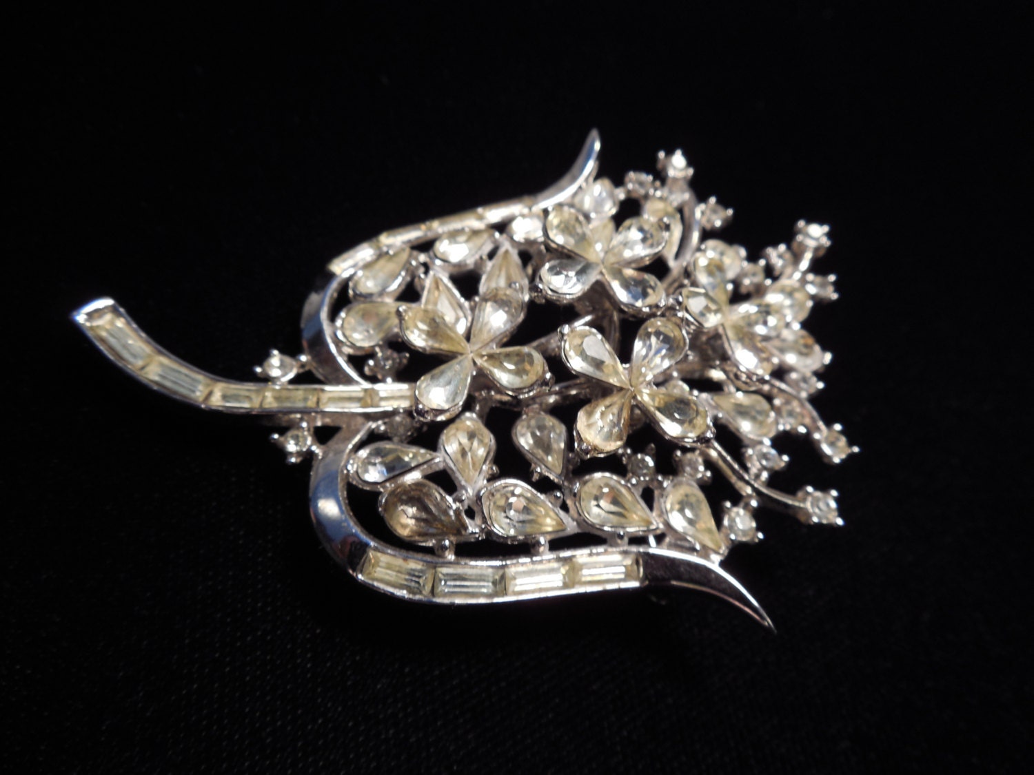 Trifari Floral Brooch. Sparkling clear rhinestone pin by