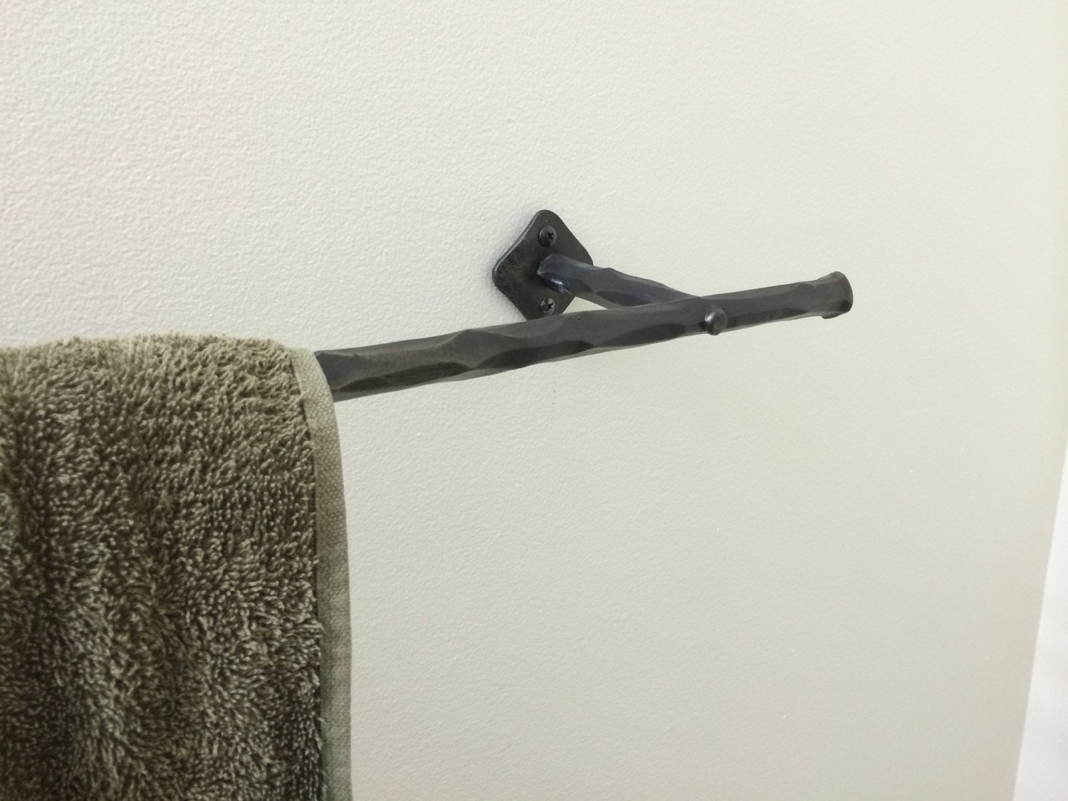 Hand wrought iron towel bar