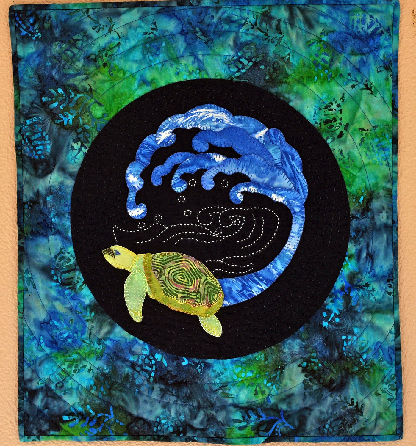 Quilted turtle batik wall hanging with sashiko and buttonhole