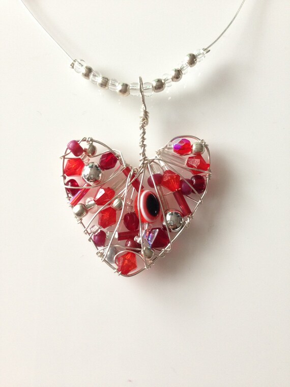 Items similar to Uniquely designed silver plated wire wrapped heart