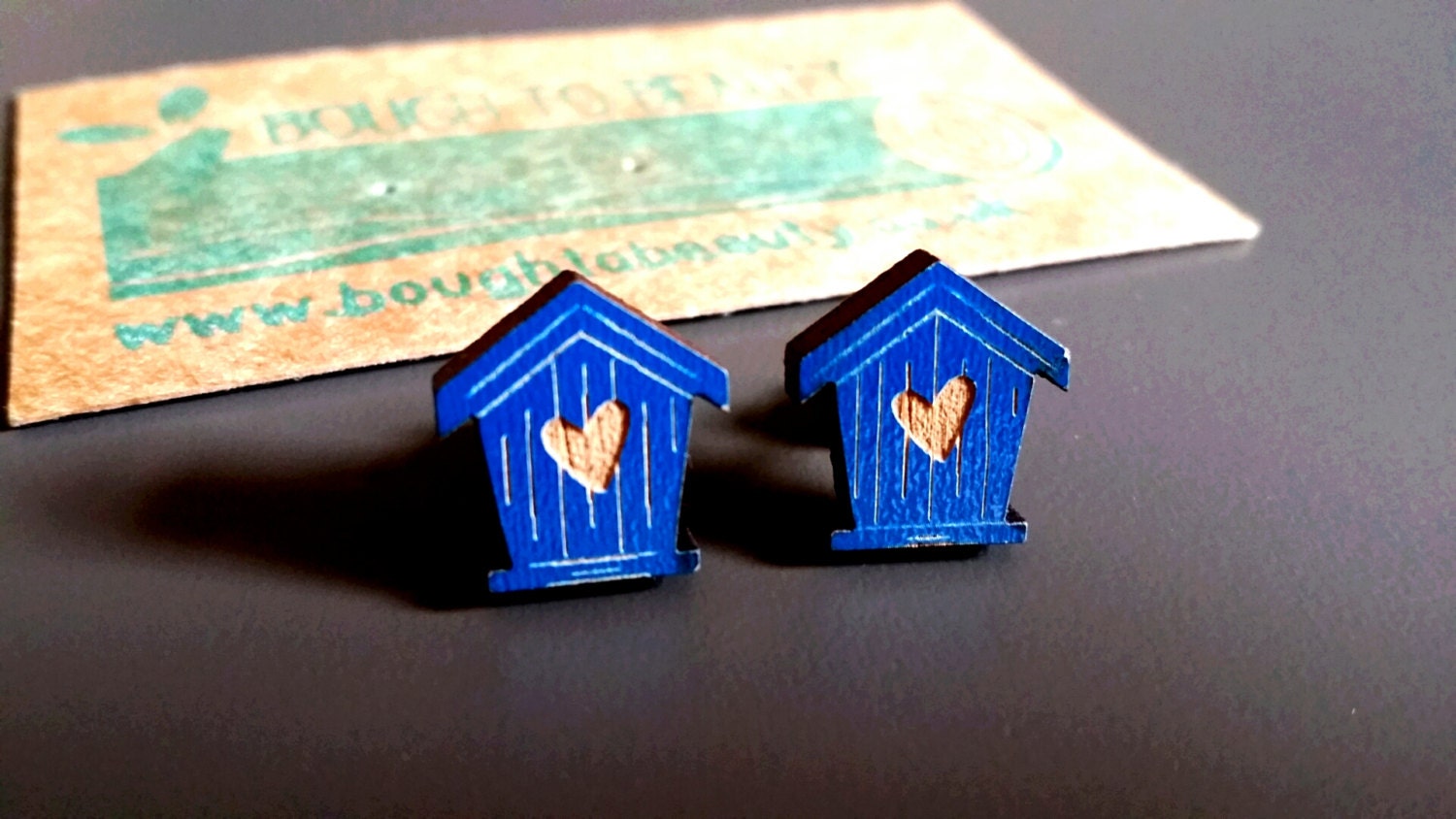 Wooden Birdhouse Earrings available in white and blue.