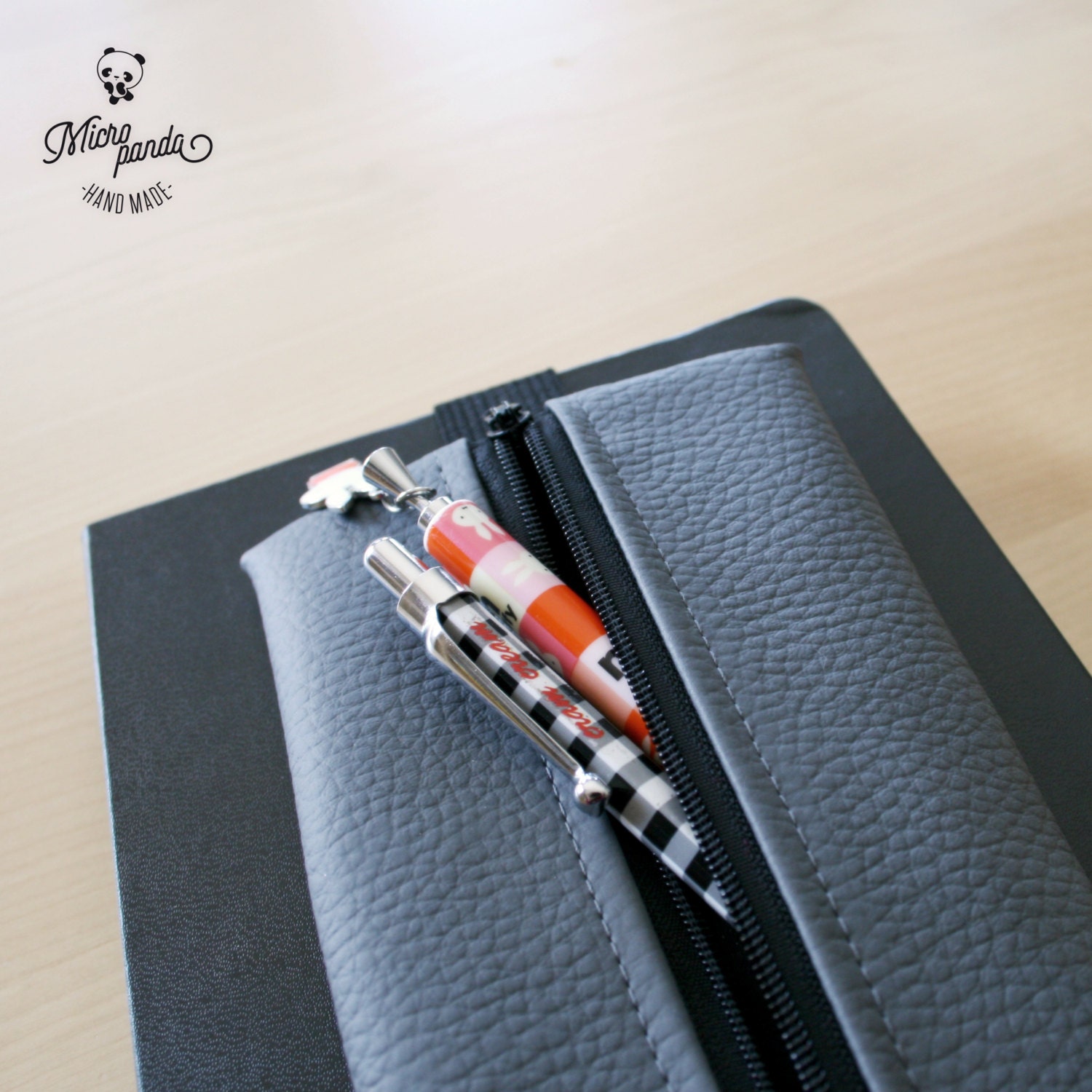 Pen case with elastic band for notebooks made with gray faux