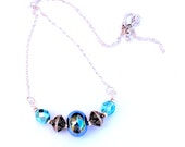 Triton Blue Glass Focal Bead Necklace. Iridescent Blue Lampwork Bead Necklace. Artisan SS Bali Beads. Elegant Statement Necklace. Triton Blue Glass Focal Bead Necklace. Iridescent Blue Lampwork Bead Necklace. Artisan SS Bali Beads. Elegant Statement Necklace.