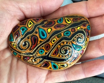 Paisley River / painted stone / orange / Aztec / fiesta / Sandi Pike Foundas / from the sea / Cape Cod