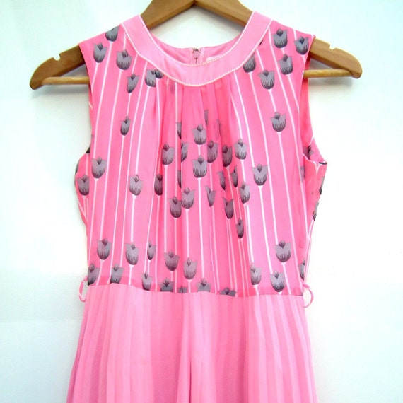 Pink dress adorned with flowers. Perfect outfit for sophisticated ladies. Perfect for spring!