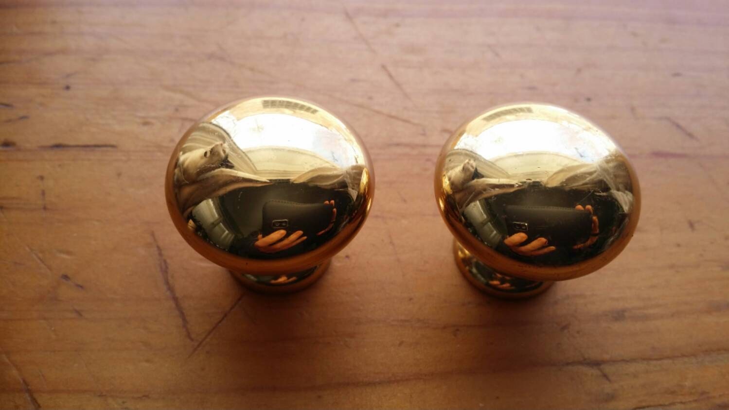 Classic drawer pulls // shiny brass knobs Haute Juice