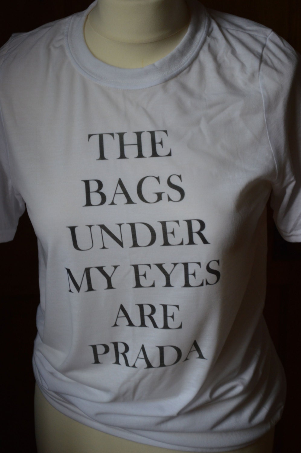 The bags under my eyes are Prada funny Tshirt. by playdonfashion