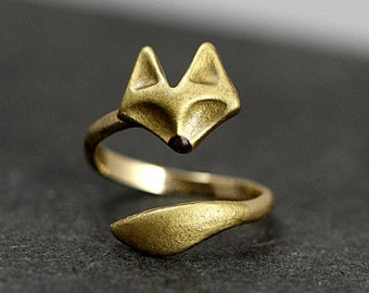 Hand gilded wrap fox ring. Adjustable brass ring with hand gilded and enameled fox face and tail.