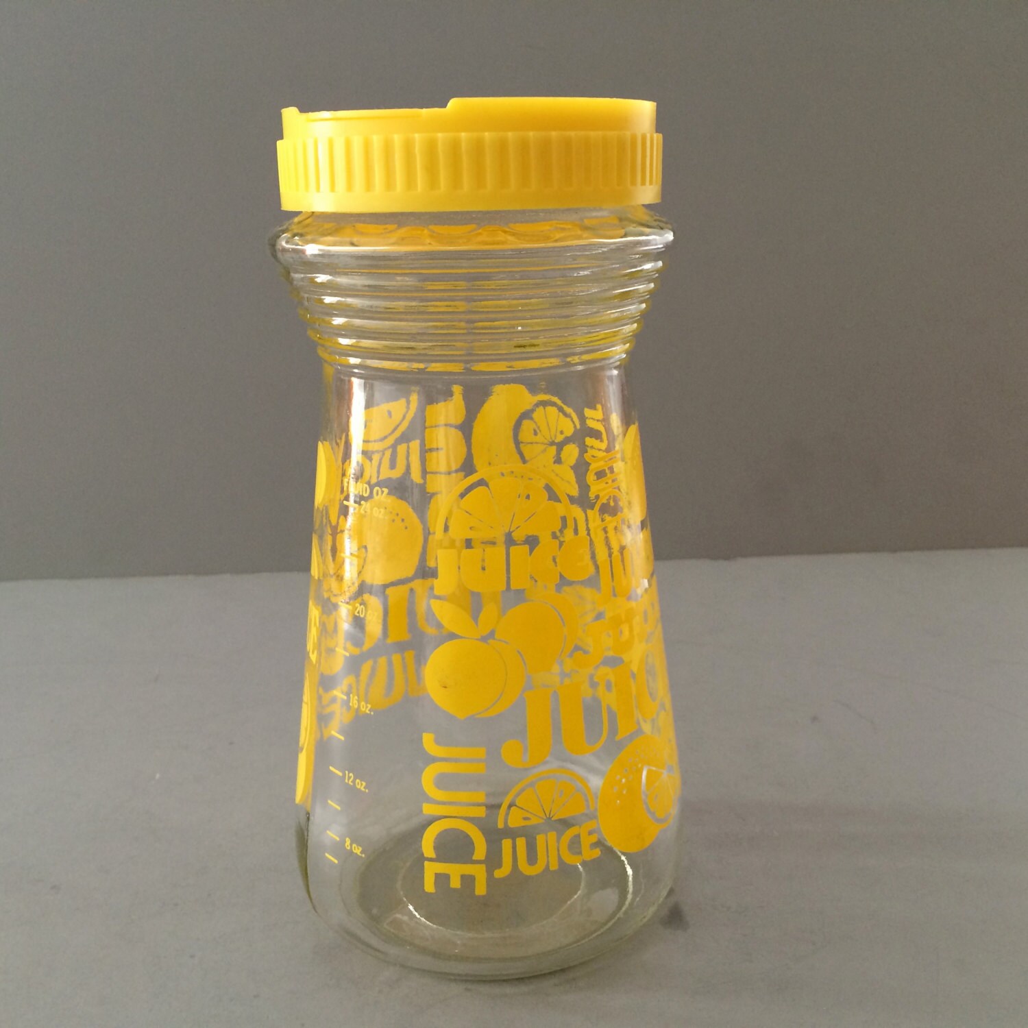Vintage ORANGE JUICE PITCHER Clear Glass with Yellow Print Plastic