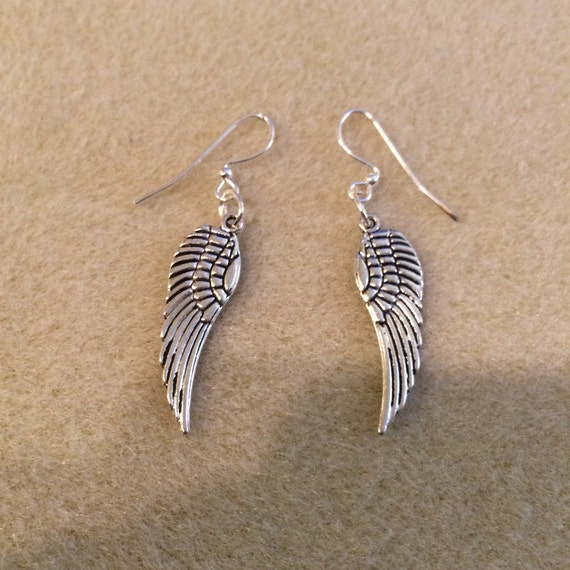 Items similar to Wing dangle earrings on Etsy