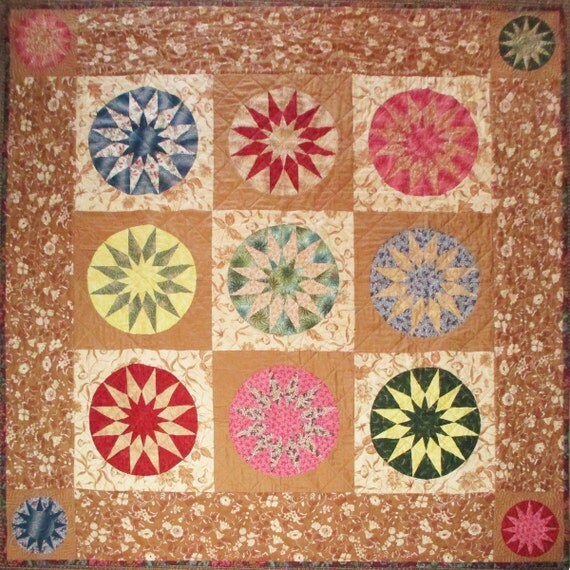Rising Sun. New Quilt by Carol Gilham Jones. Cover quilt for