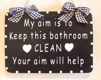 My aim is to keep this bathroom clean Your aim will help