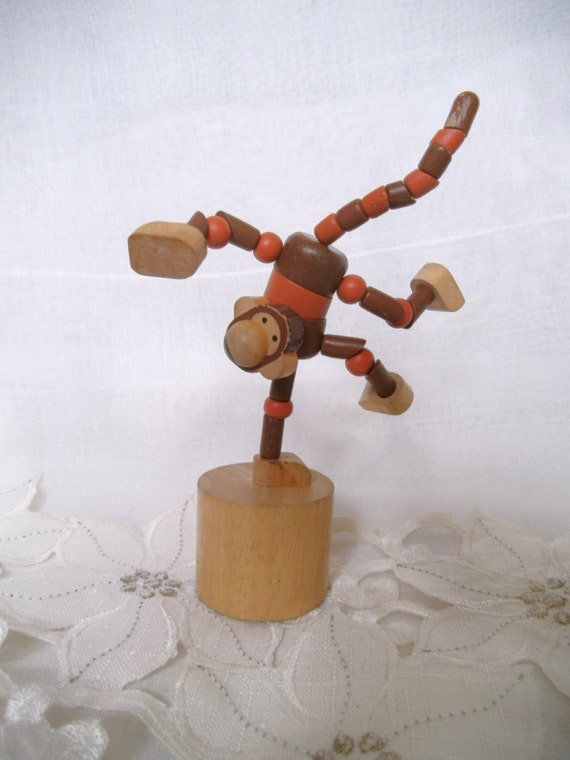 Vintage wooden pushbutton puppet monkey