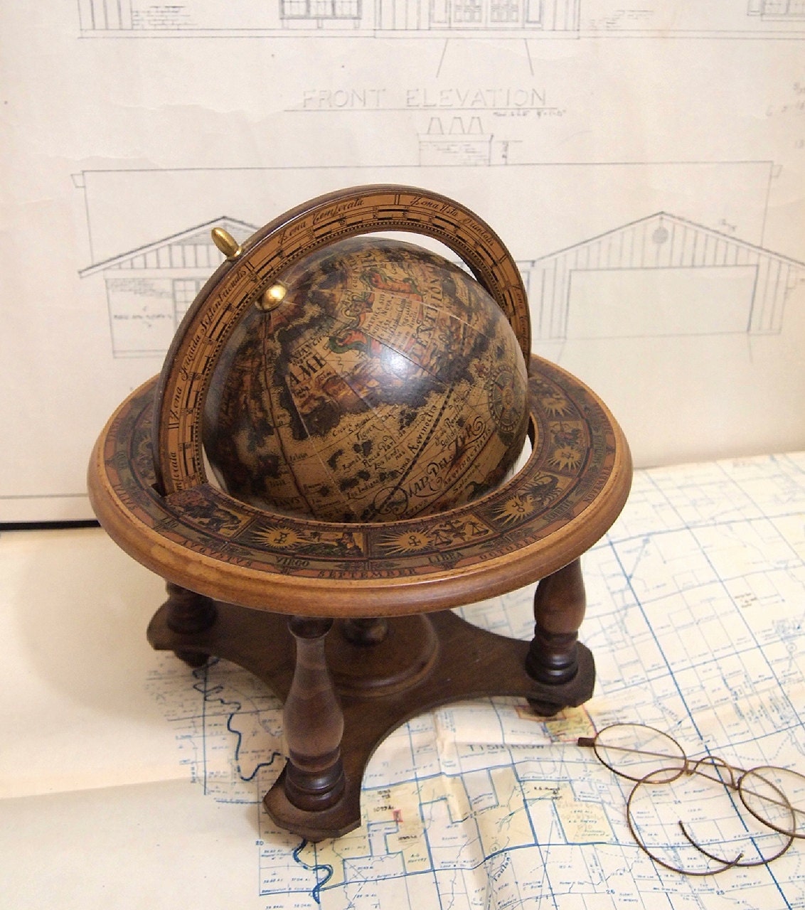 Small globe on wood stand Excellent condition Made in Italy