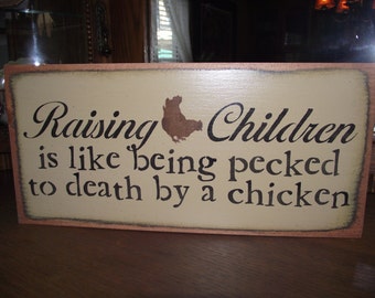 Raising Children is like being pecked to death, primitive wood sign