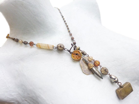 Light travels. Rustic Victorian tribal lariat in golden amber yellow.