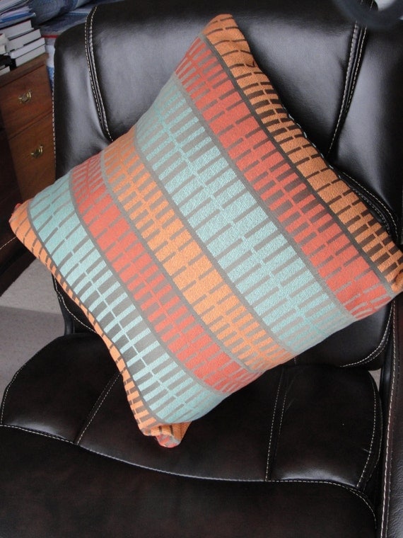 pillow cover in southwestern tones orange rust turquoise