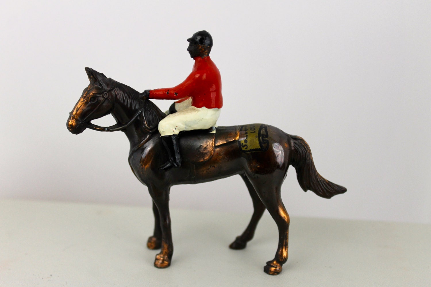 horse jockey figurine