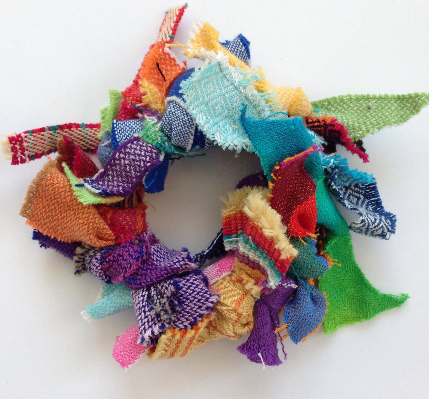Wrap Scrap Wreath Ornament or Decoration, made from various colorful woven wrap scraps.