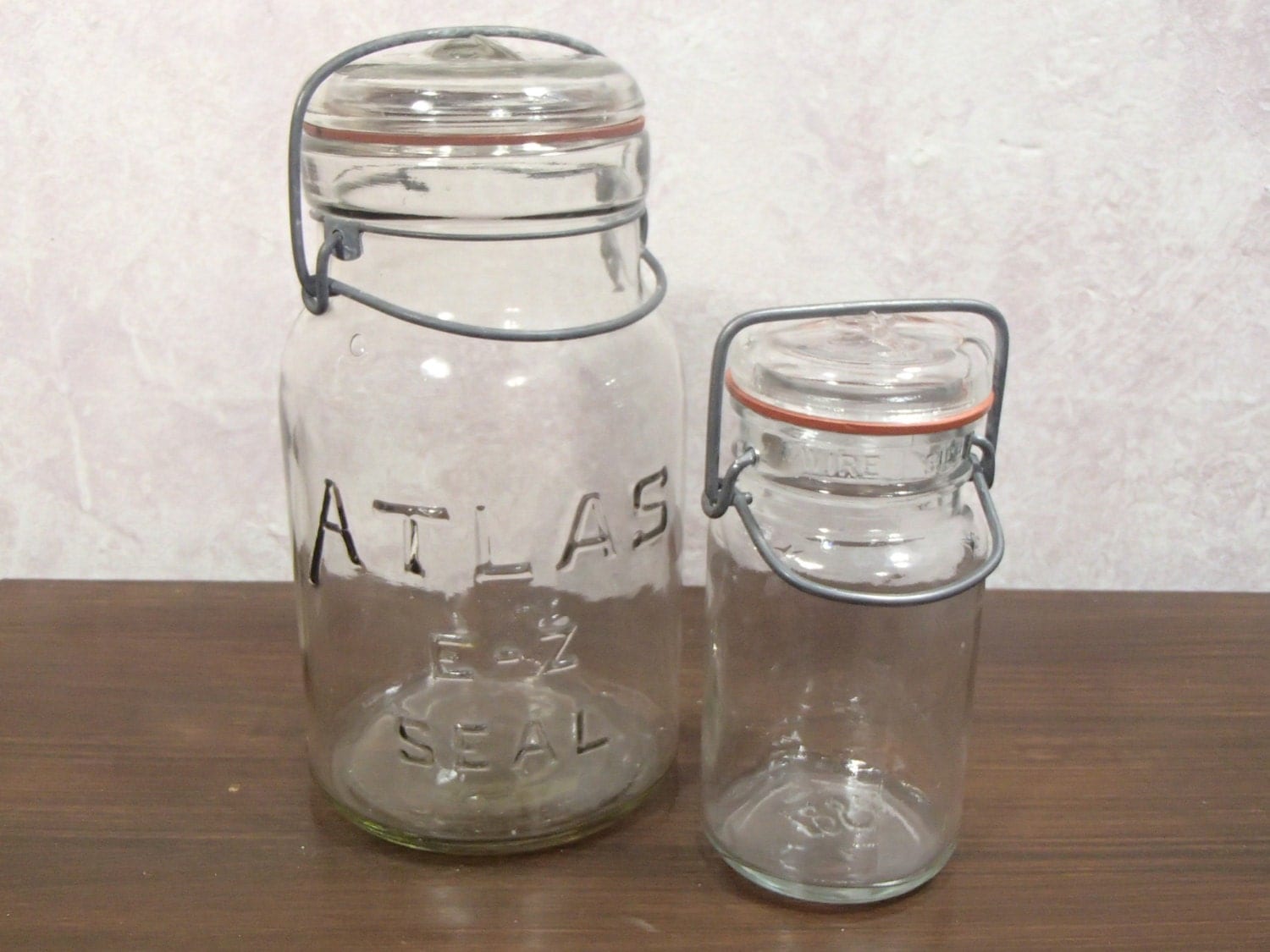 Set of 2 Clamp Lid Clear Glass Jars with Rubber Seals, Large One is Marked Atlas EZ SEAL Small