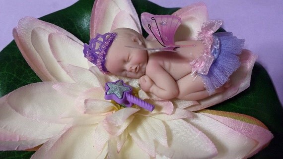 Sleeping princess baby on lily pad