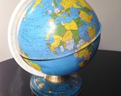 Distressed vintage metal globe estimated 1990 earth nineties eighties