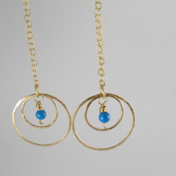 Long gold dangle hoop earrings Long gold dangle hoop earrings