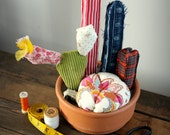 Cactus garden , recycled fabrics . Cactus garden , recycled fabrics .