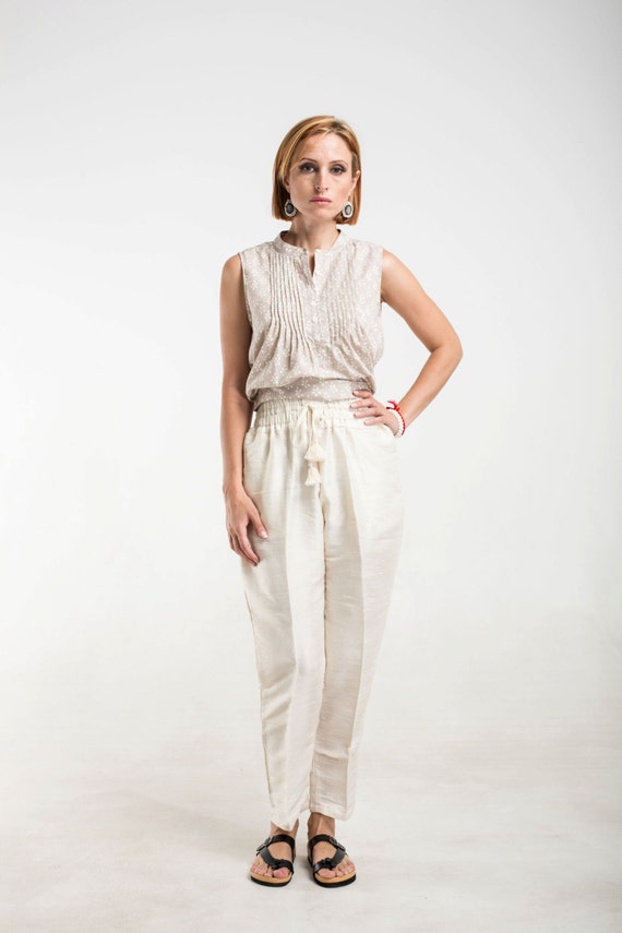 cream silk pants with pockets gathered waist and tassels