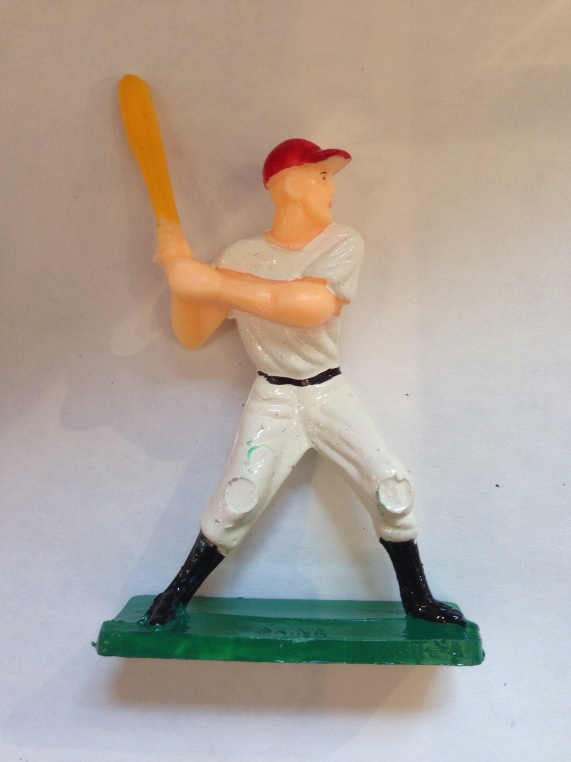 miniature baseball player figurines