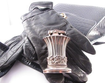 silver coloured cigarette lighter.