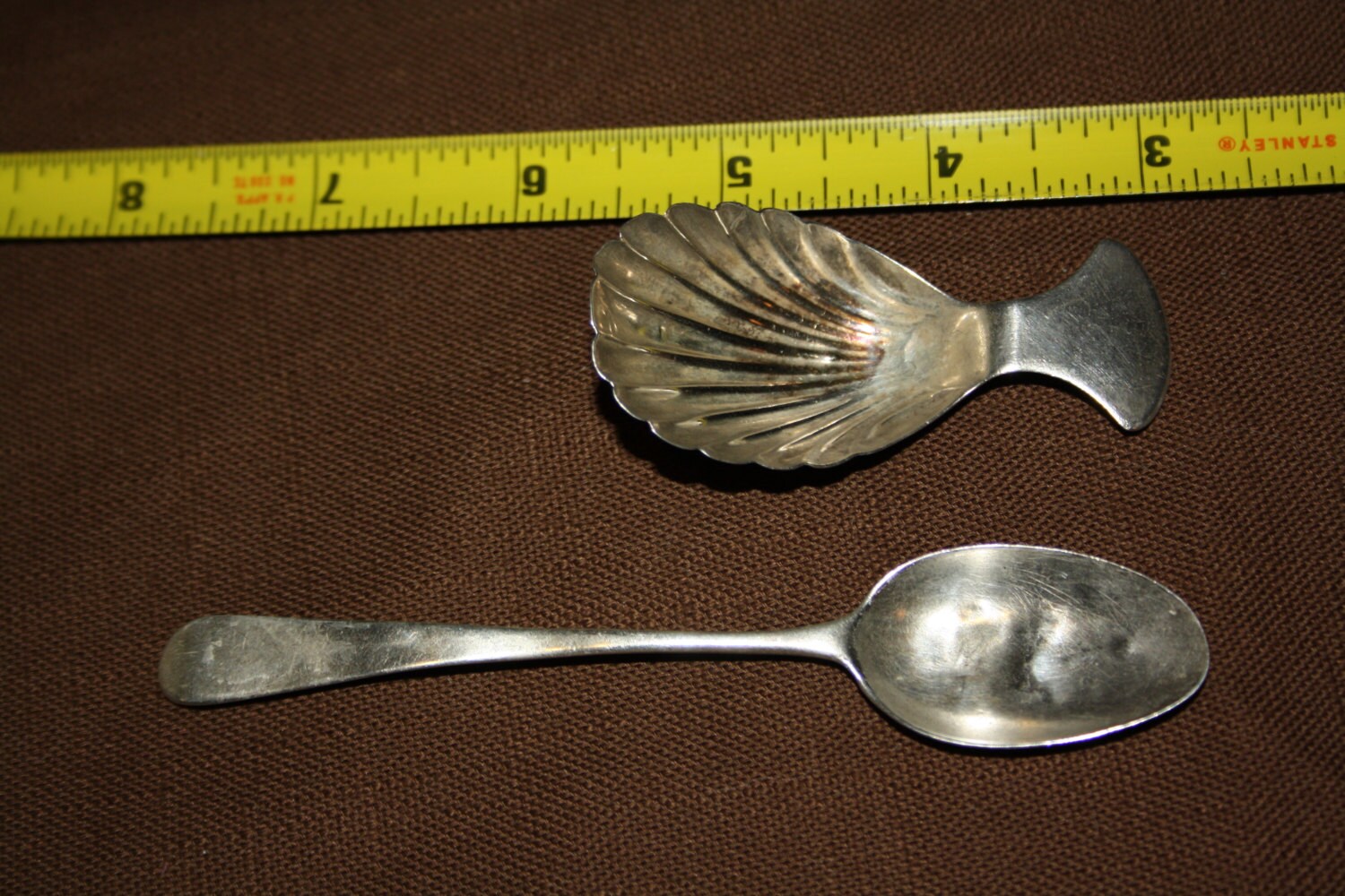 Two items Damage Sterling Silver Spoon and an English Tea
