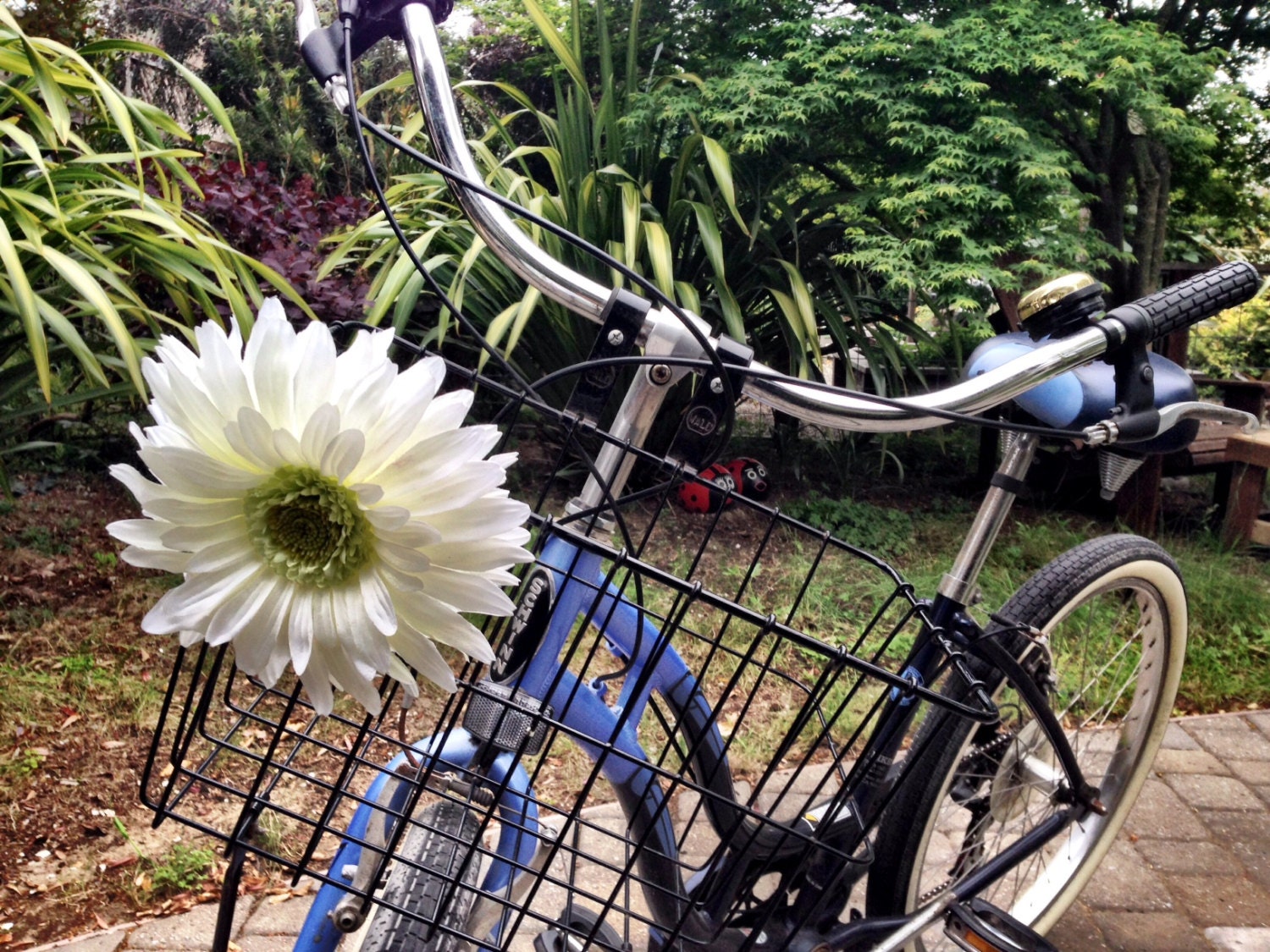 white bike basket with flowers