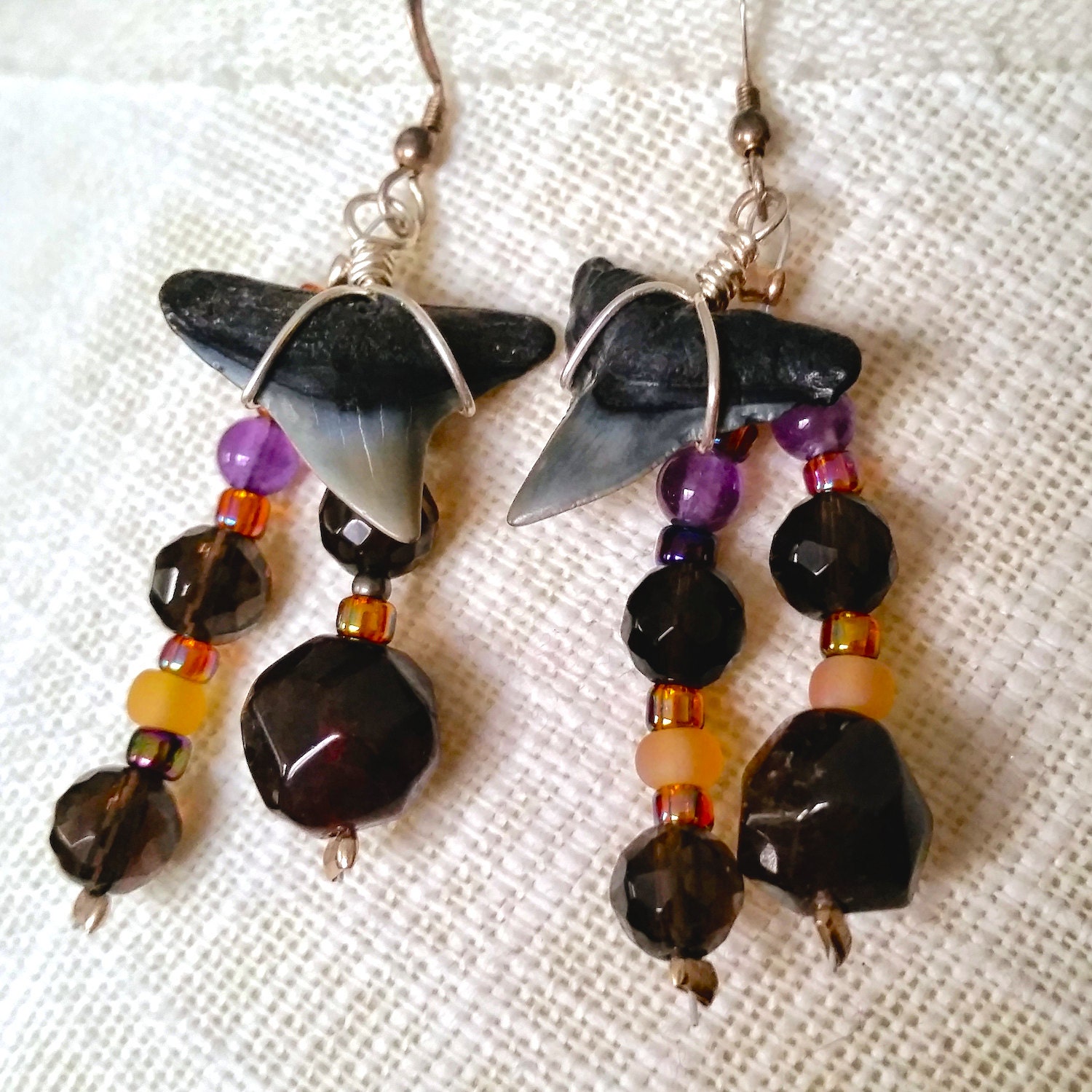 Fossilized shark tooth earrings with garnet