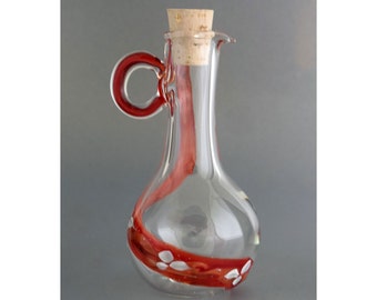 Hand blown glass oil jug with red/amber spiral flower path