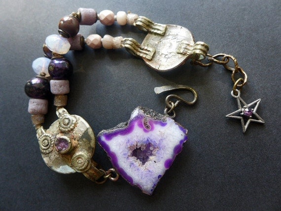 Ubuntu . Rustic assemblage bracelet in shades of purple violet with kuchi and druzy agate slice.