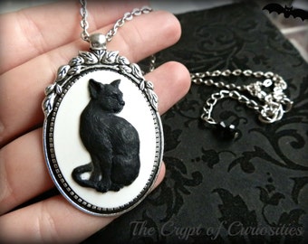 Antique silver black cat cameo necklace.