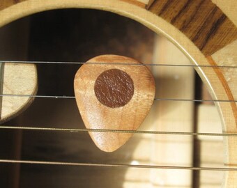 Beautiful maple wood guitar pick with leather friction pads.