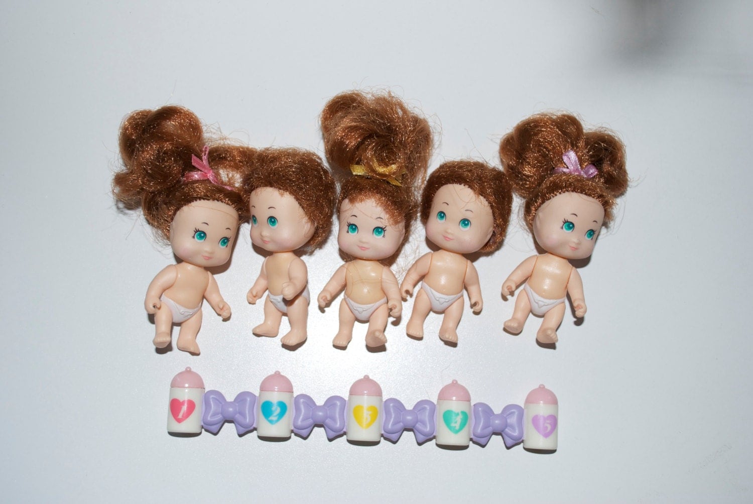 quints cousins dolls