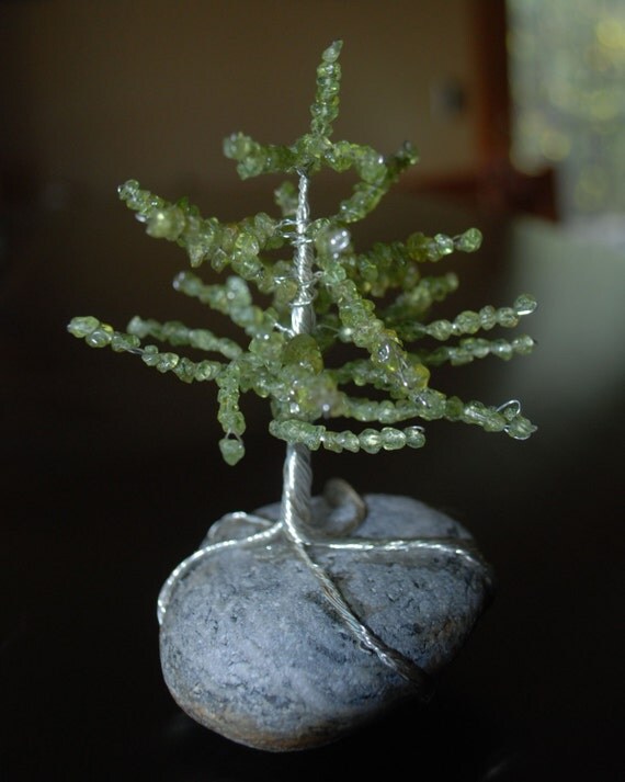 peridot and silver wire pine christmas tree sculpture on river peridot and silver wire pine christmas tree sculpture on river