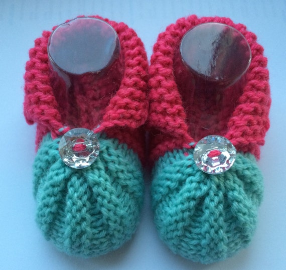 Hand knitted baby shoes in coral and duck egg blue fit up to 6 months of age with crystal button trim