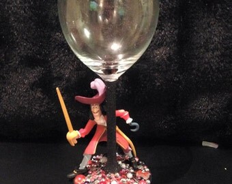 captin hooks ship on glass bottle