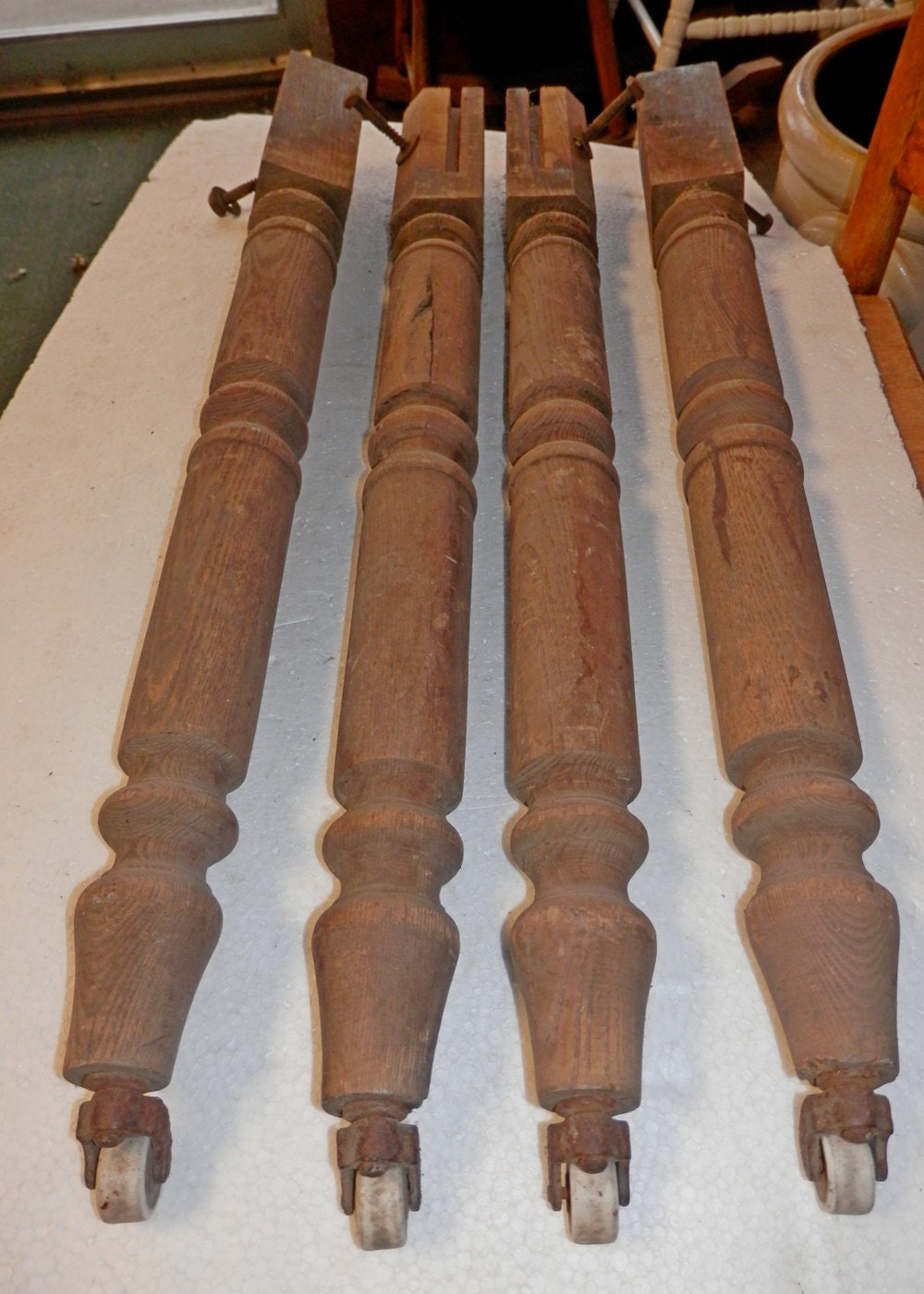 set of 4 matching ash wood table legs with antique porcelain