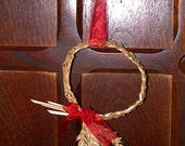 Sweet little plaited straw Christmas Wreath decoration with red bow