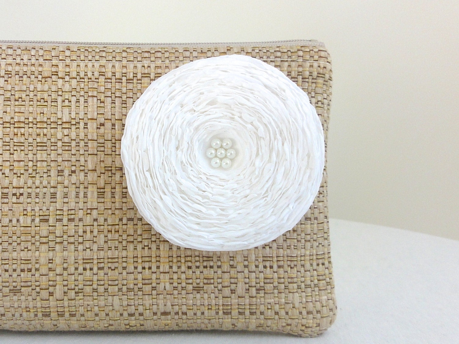 tan woven clutch