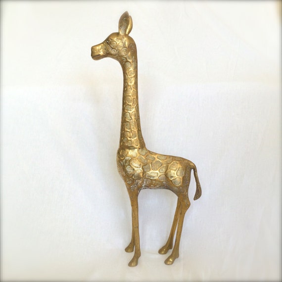 large brass giraffe statue